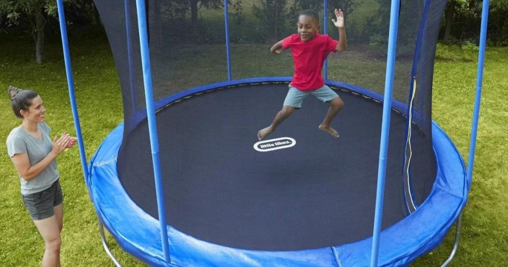 kid bouncing on a trampoline