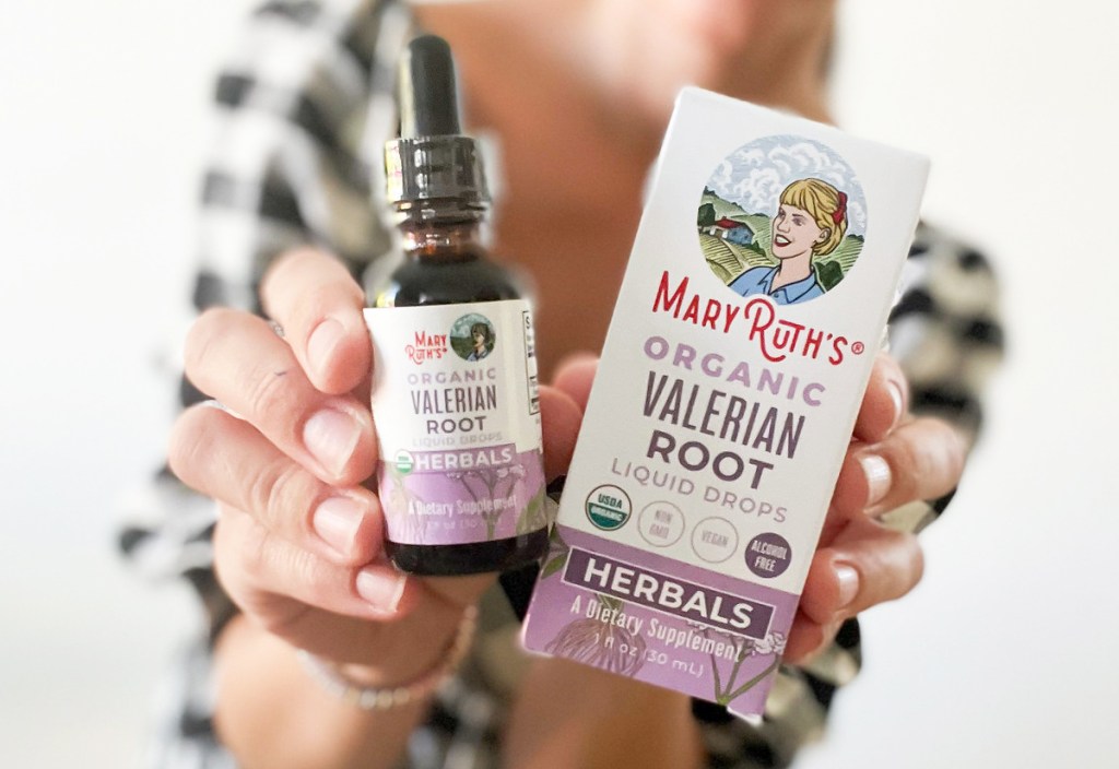 holding up MaryRuth's Organics Valerian Root Liquid Drops