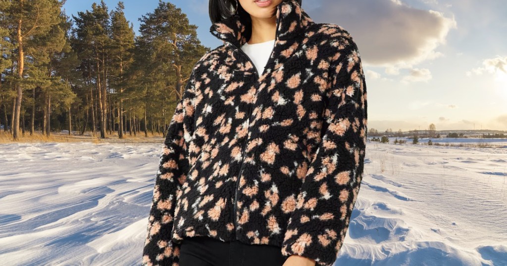 woman in black cheetah print coat outdoors in snow