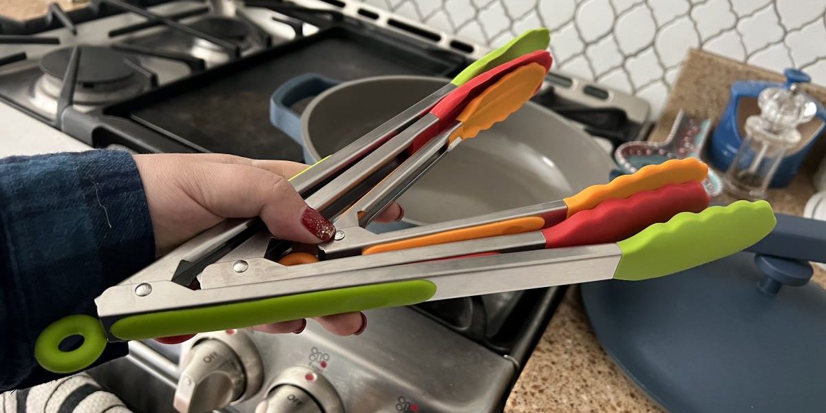 hand holding kitchen tongs