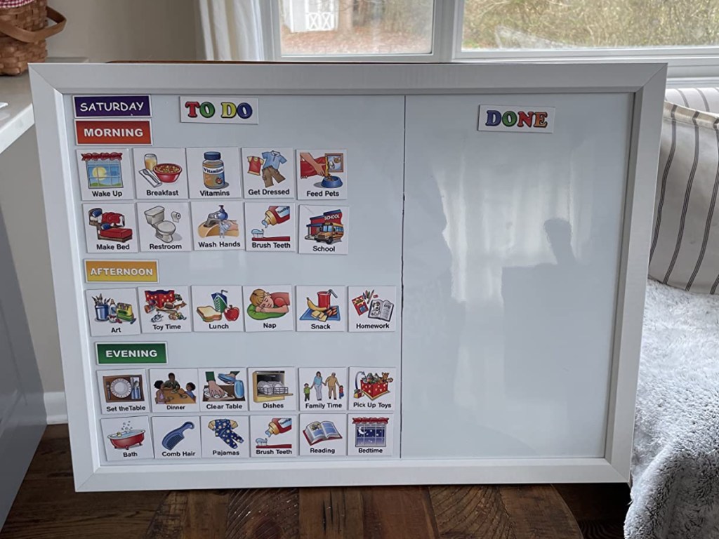 whiteboard with kids chore chart in home