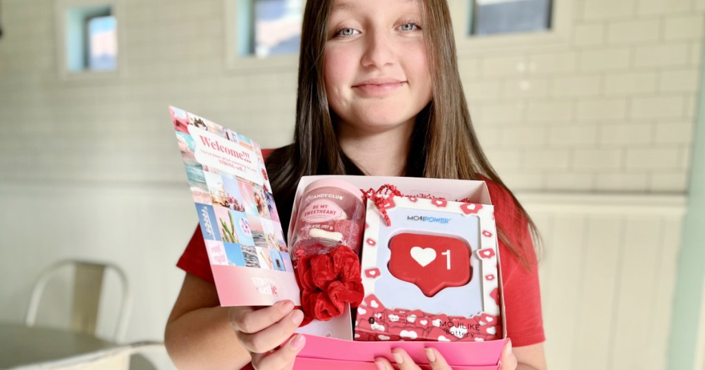 teen girl holding STRONG Selfie Box