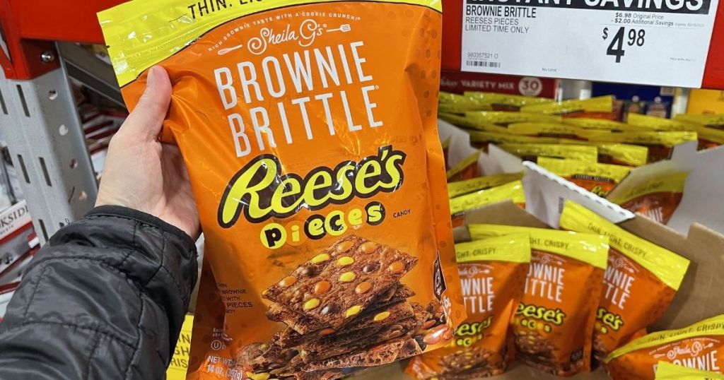 hand holding a bag of brownie brittle