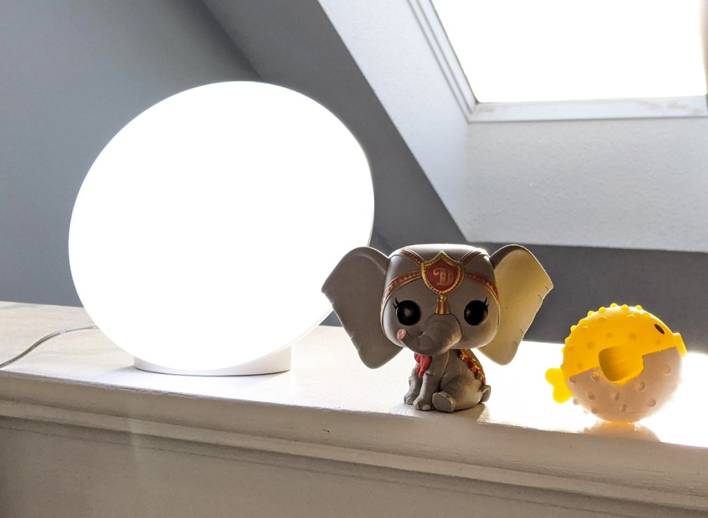 light therapy lamp next to toys