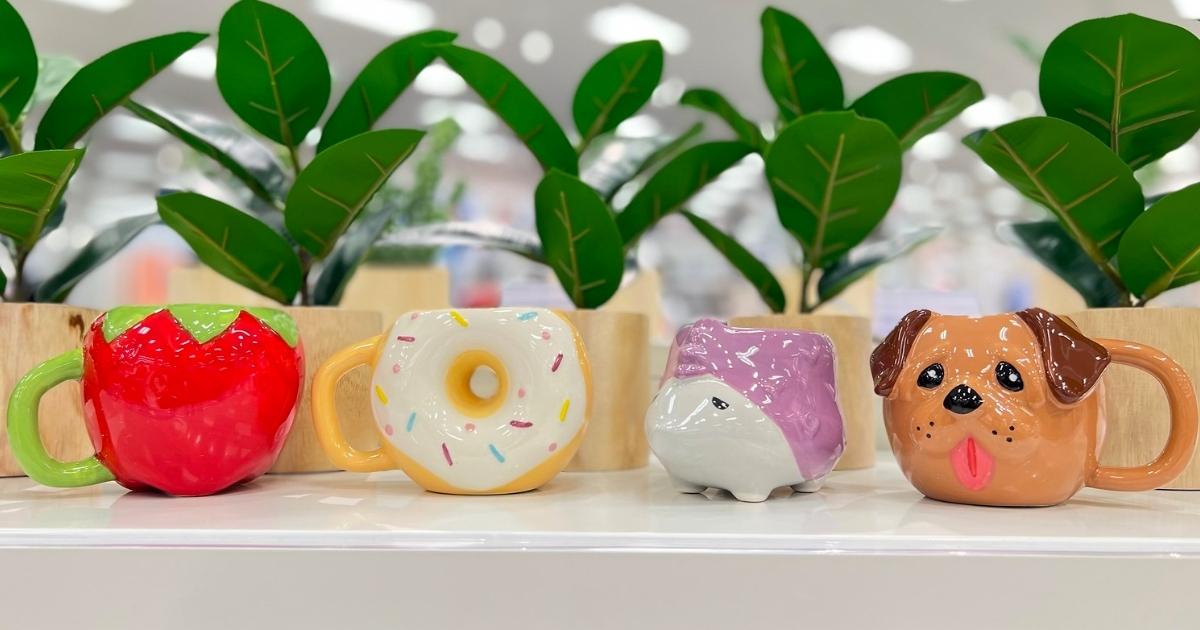 target coffee mugs shaped like a strawberry, donut, porcupine, and a dog