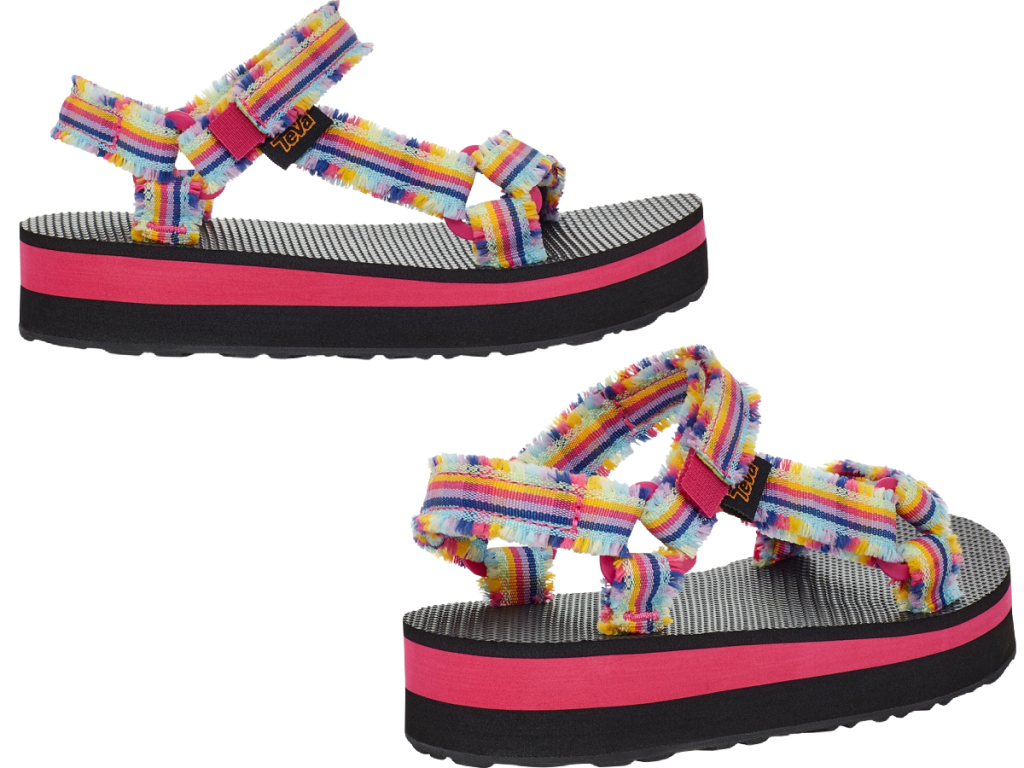 pair of multicolored sandals with frayed fabric on white background
