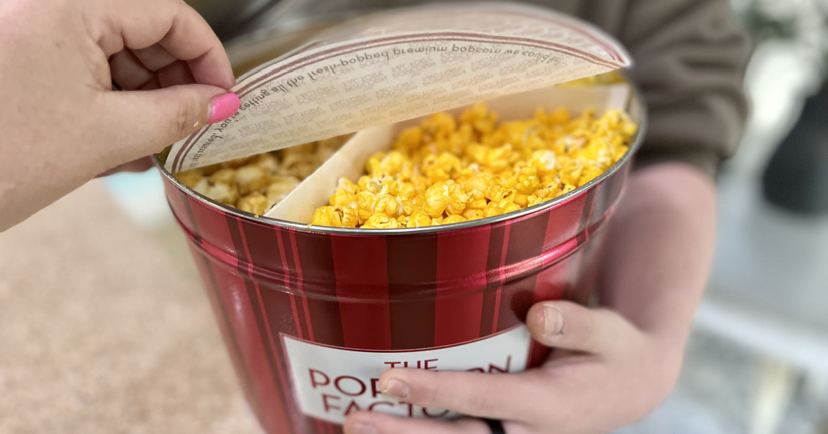 Hand opening popcorn tin