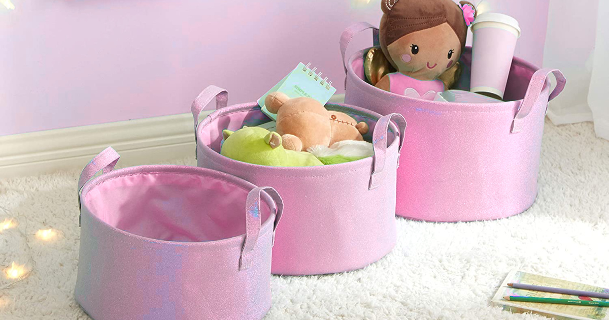 three round pink glitter bins filled with toys in childs' room