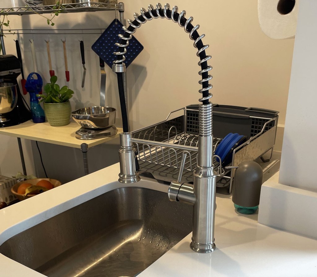 silver pull down kitchen faucet on sink