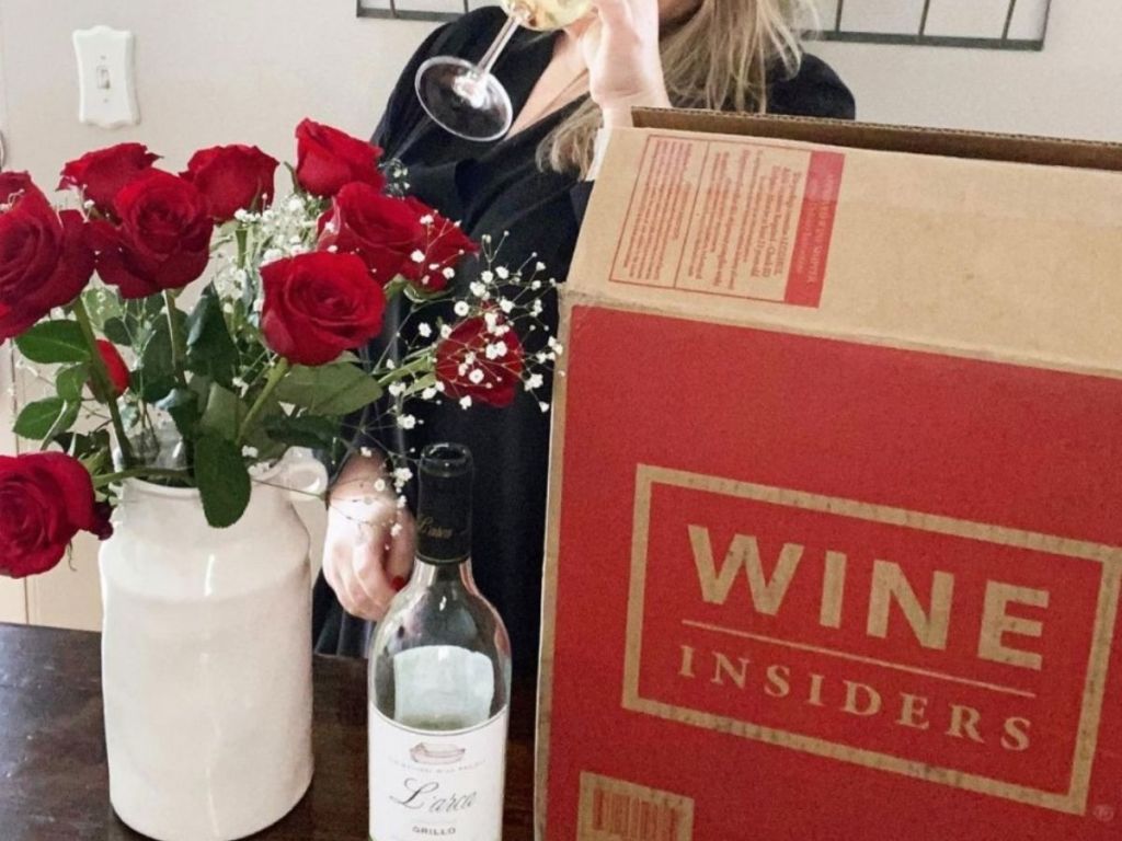 woman standing behind Wine Insider box