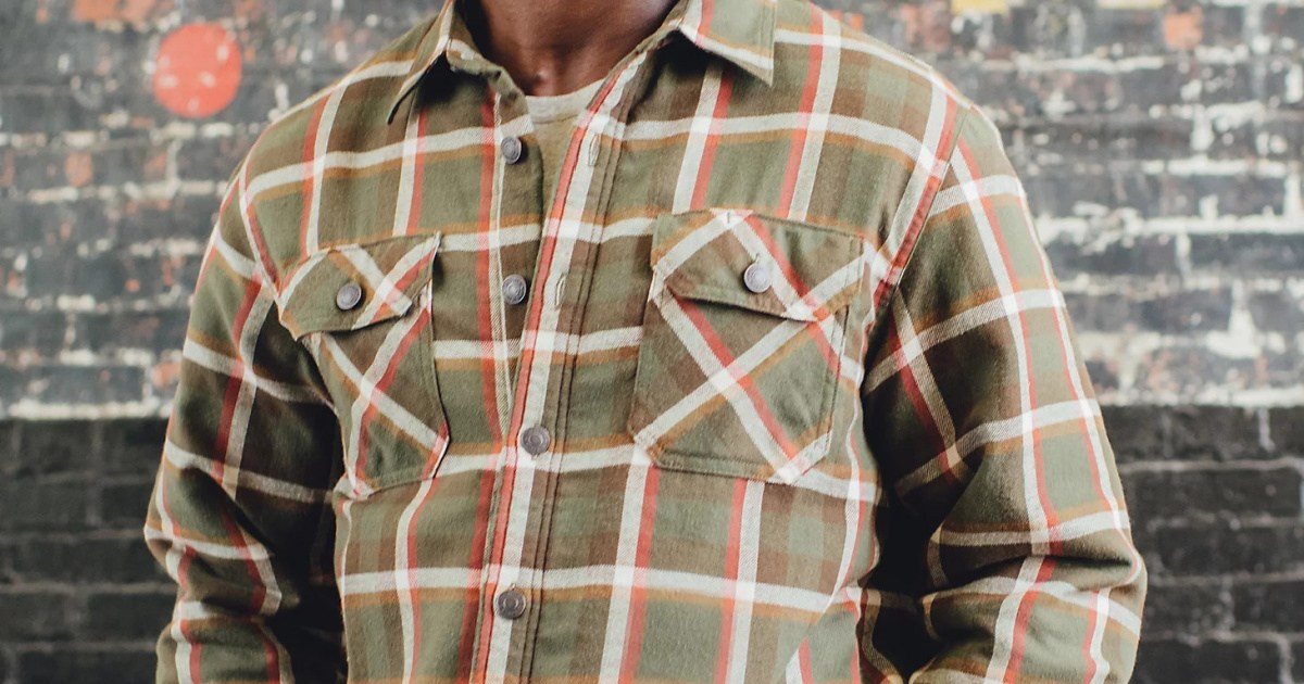 man wearing light brown and red plaid shacket