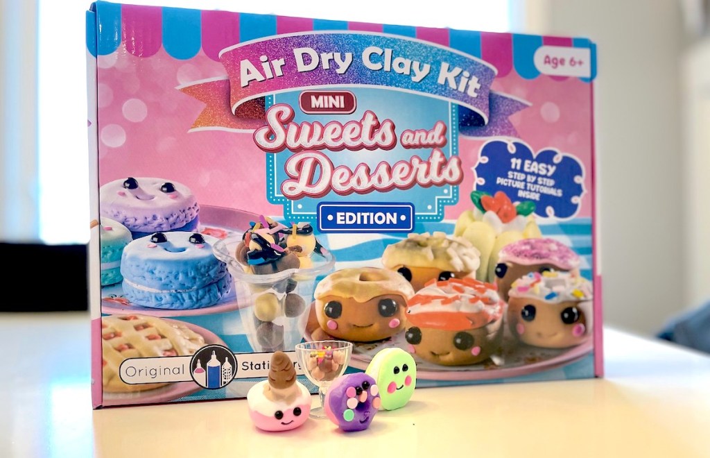 air dry clay kit box with miniature clay food items on table