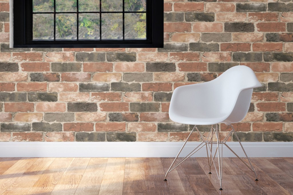 brick wallpaper behind white chair