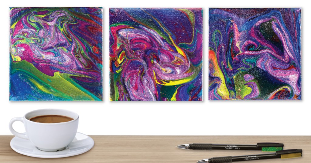 three marbled canvases on wall