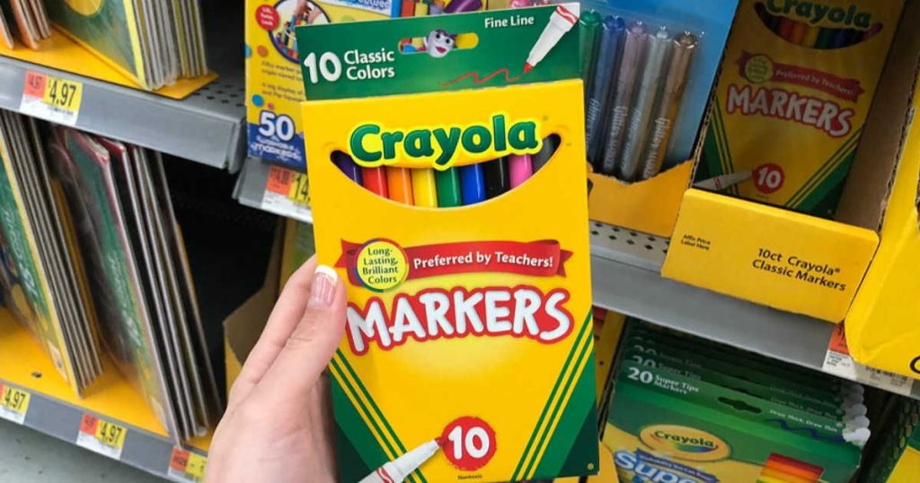 holding a 10-pack of fine-tip markers