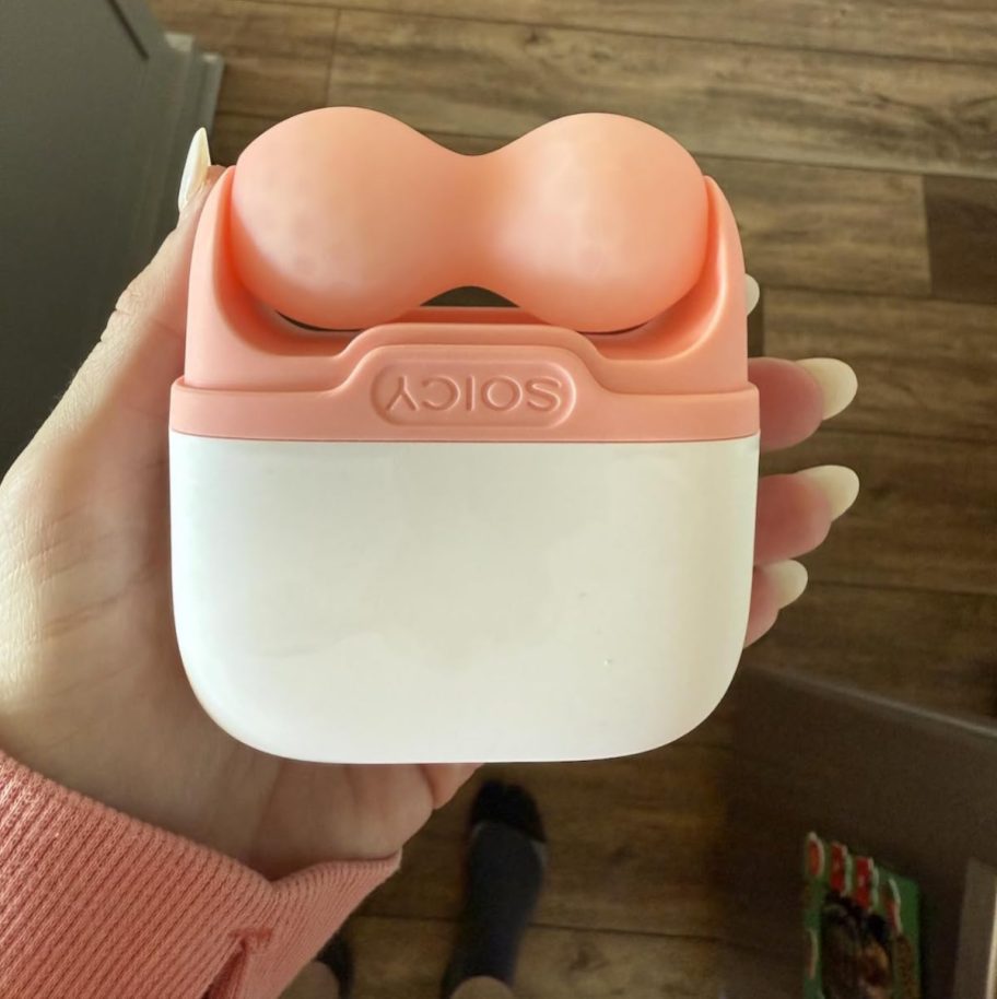 hand holding facial ice roller