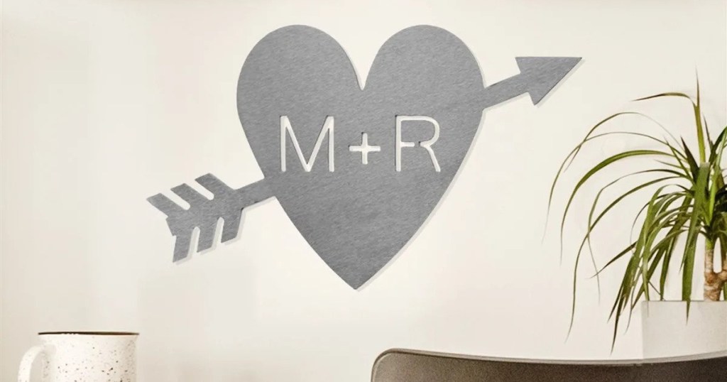 metal heart-shaped sign with initials