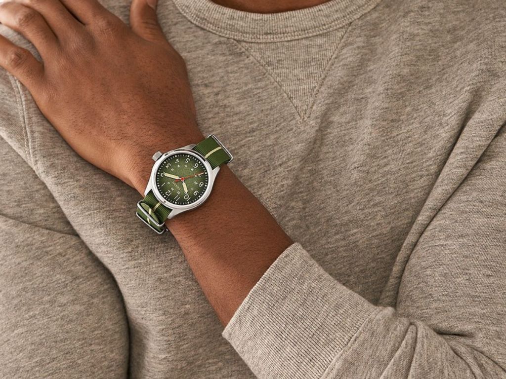 man wearing Fossil watch with green band and green face