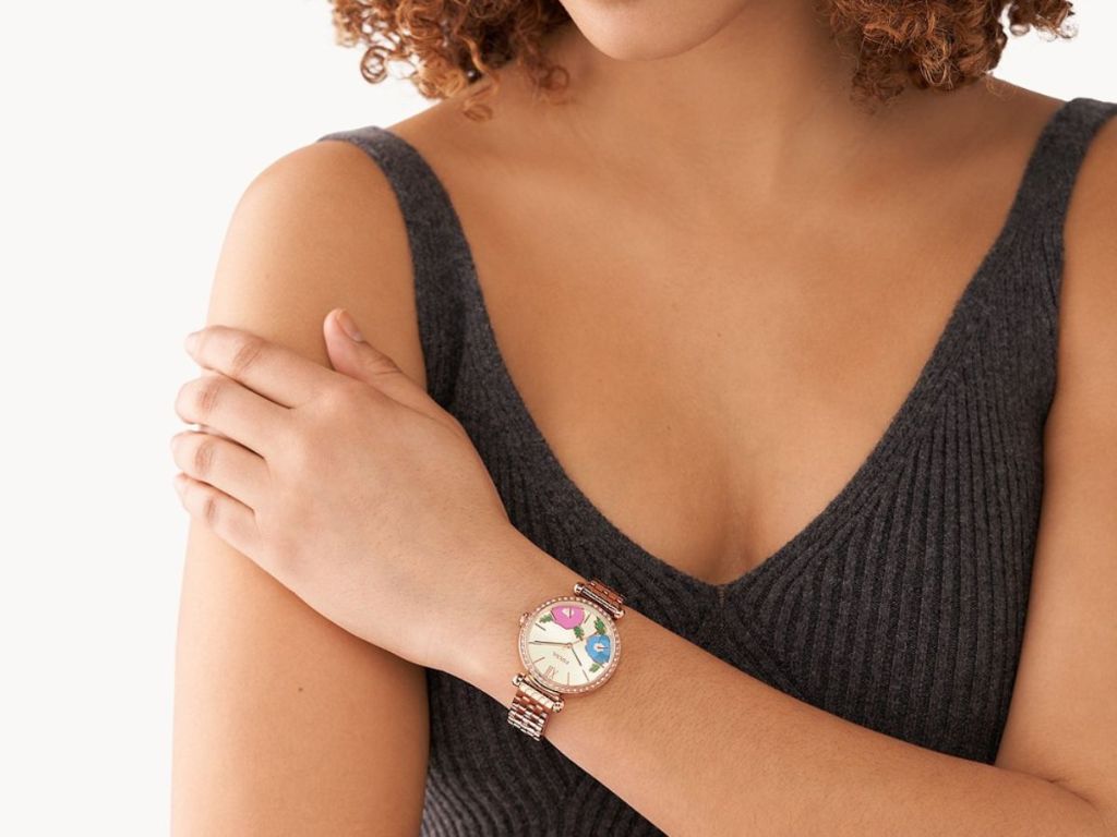 woman wearing Fossil watch with flowers on the front