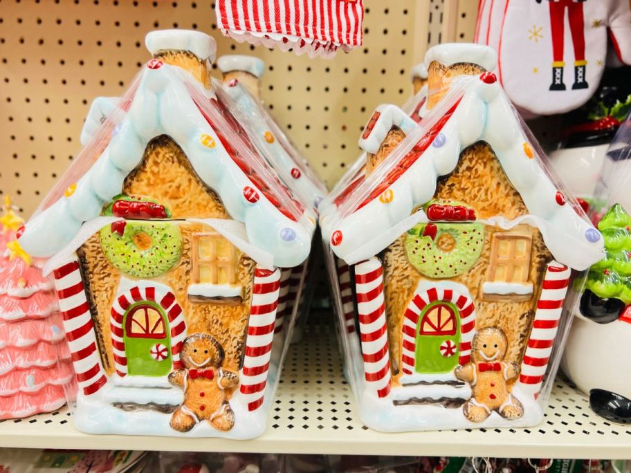 gingerbread house cookie jars on a store shelf