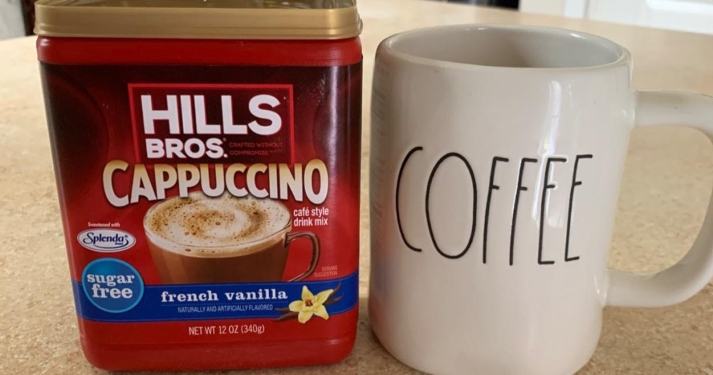 sugar-free cappuccino next to coffee mug