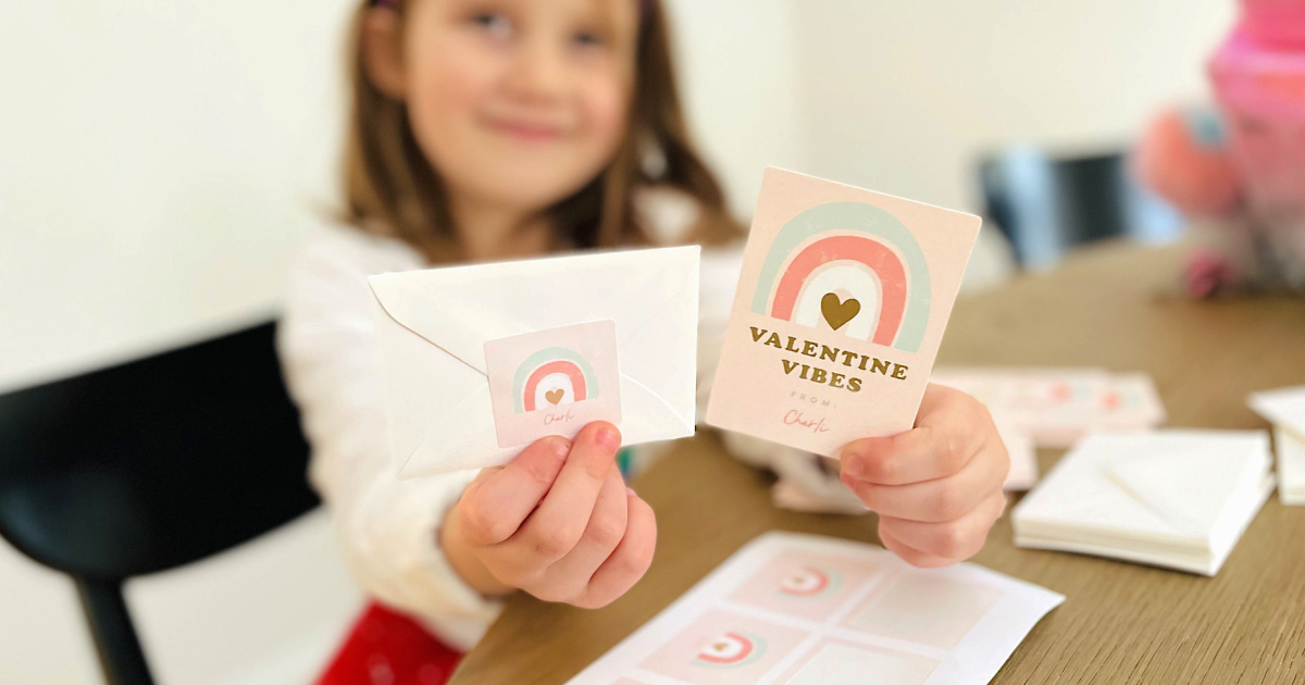 little girl holding Minted Valentine Day card 