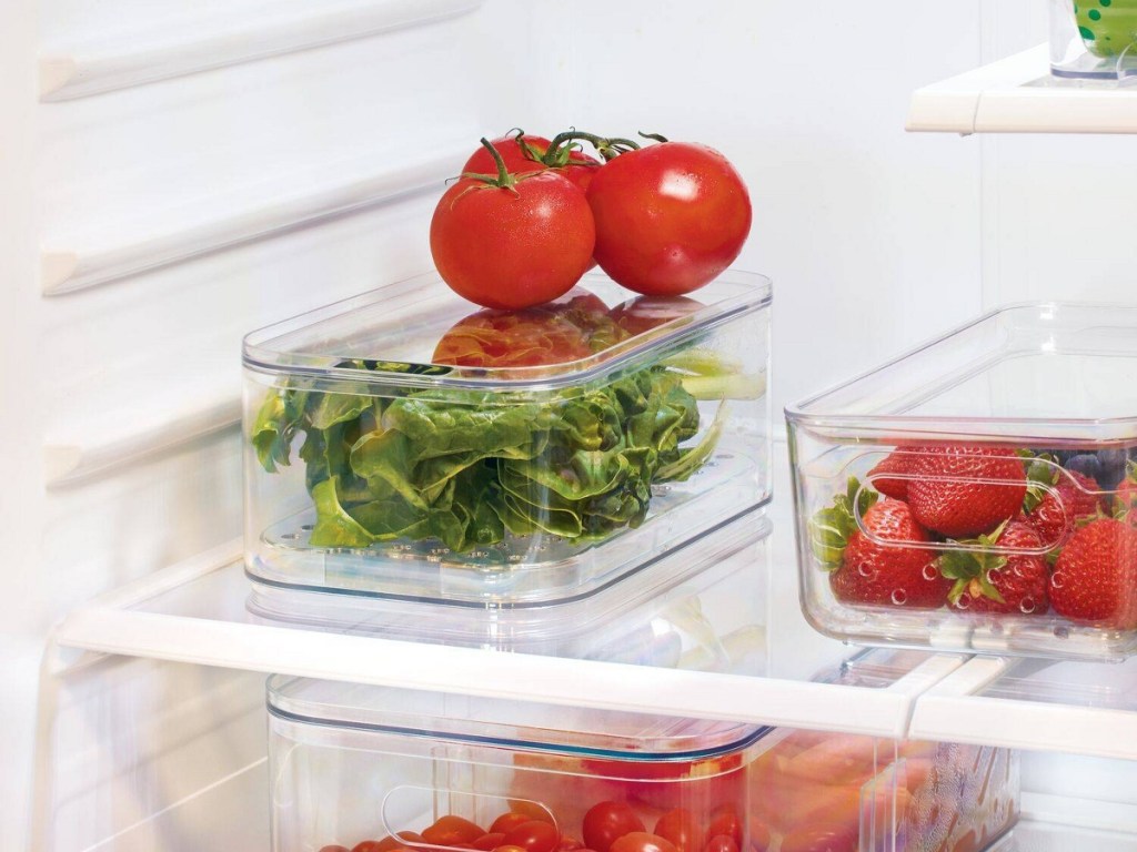 produce in clear storage bin in fridge