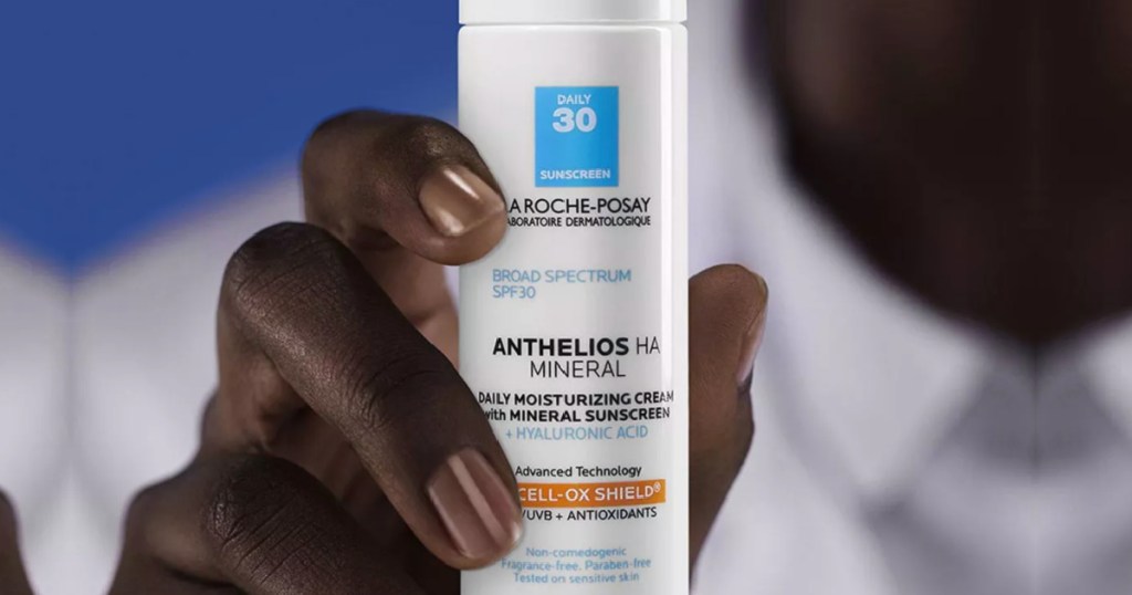hand holding la roche posay anthelios mineral sunscreen