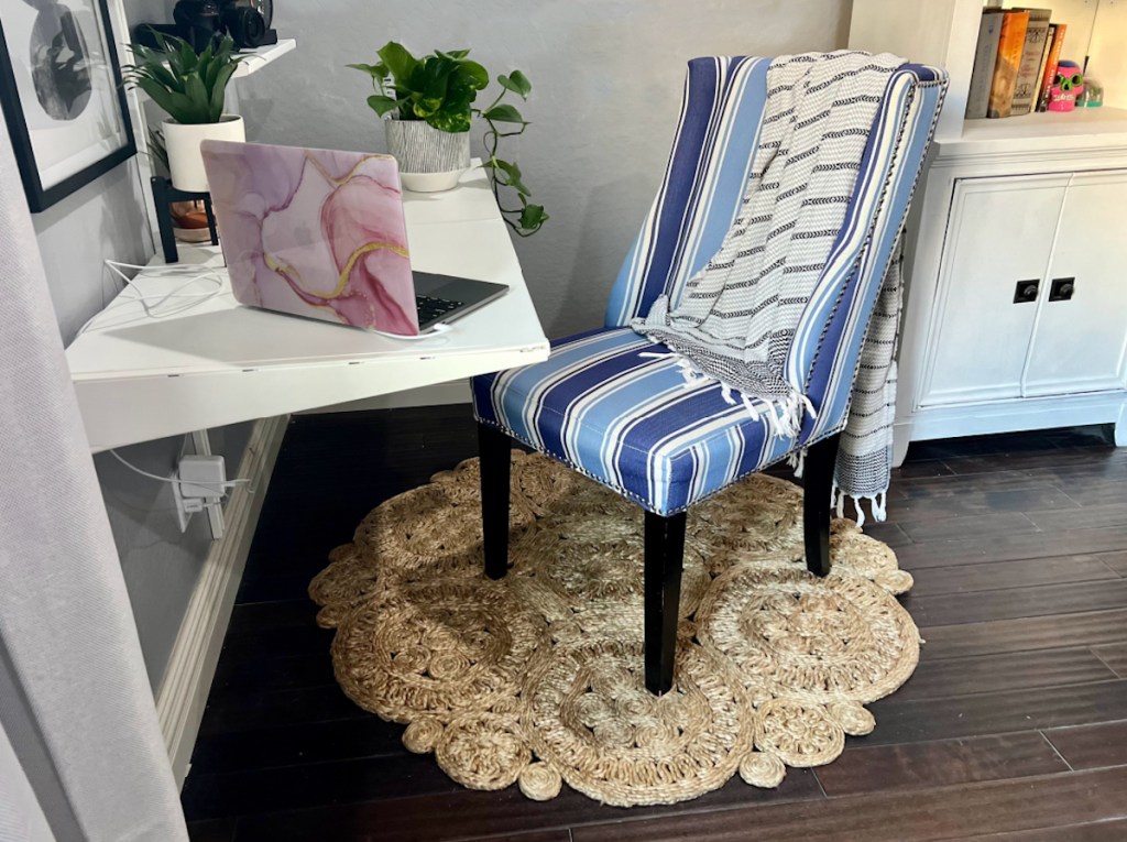 office space with chair and round jute rug