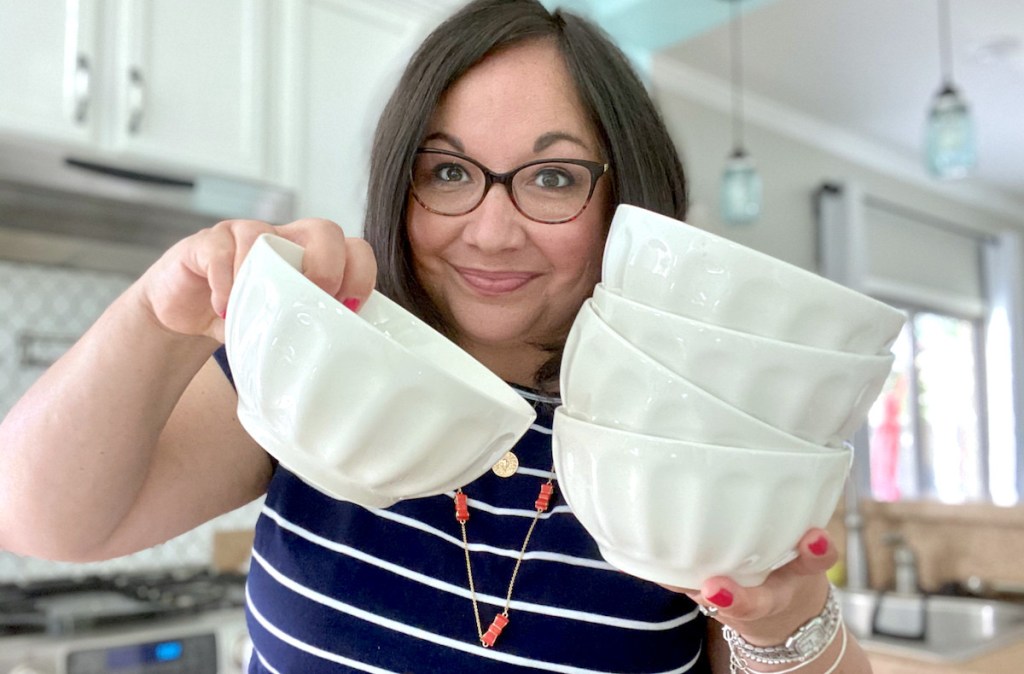 woman holding up white latte bowls in kitchen - best things to buy on amazon