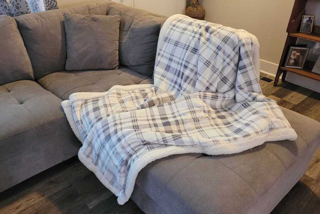 white and gray plaid blanket on gray sectional couch