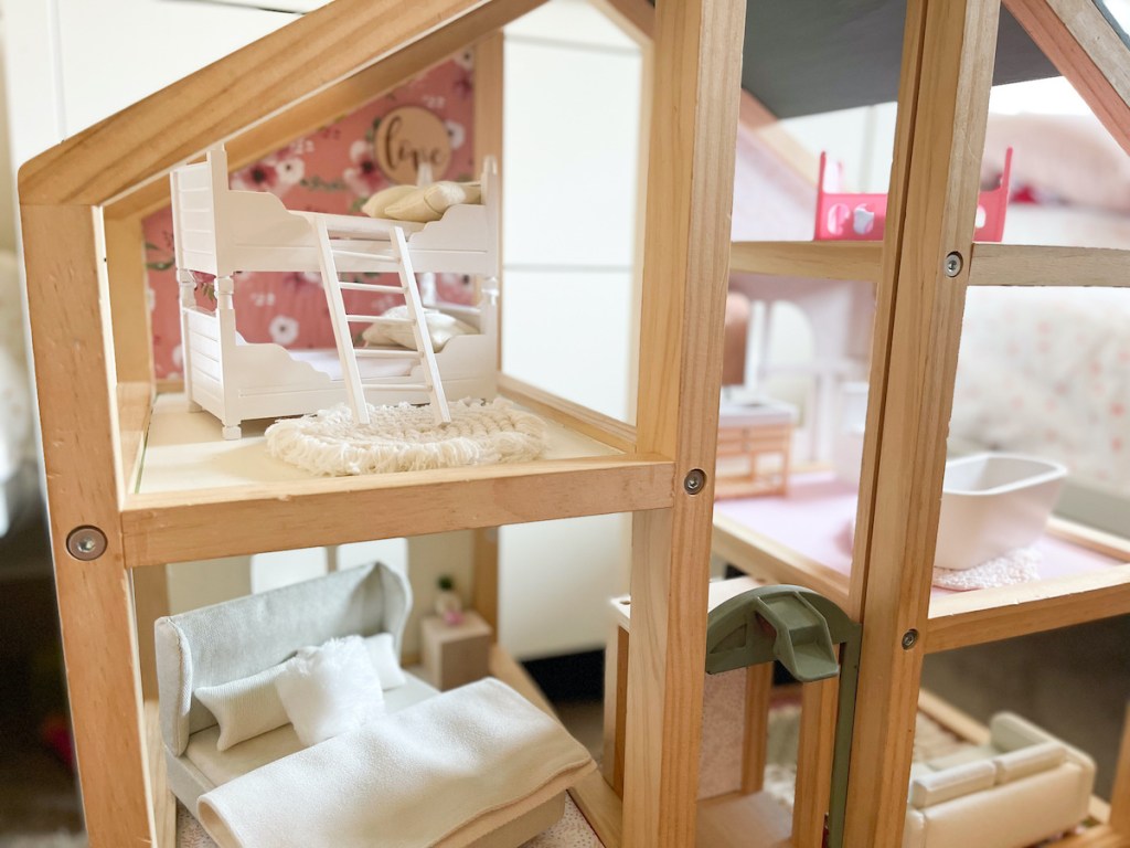 close up of dollhouse with bunk beds and ladder inside