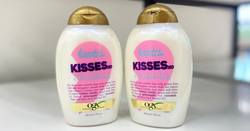 two bottles of ogx kisses conditioner
