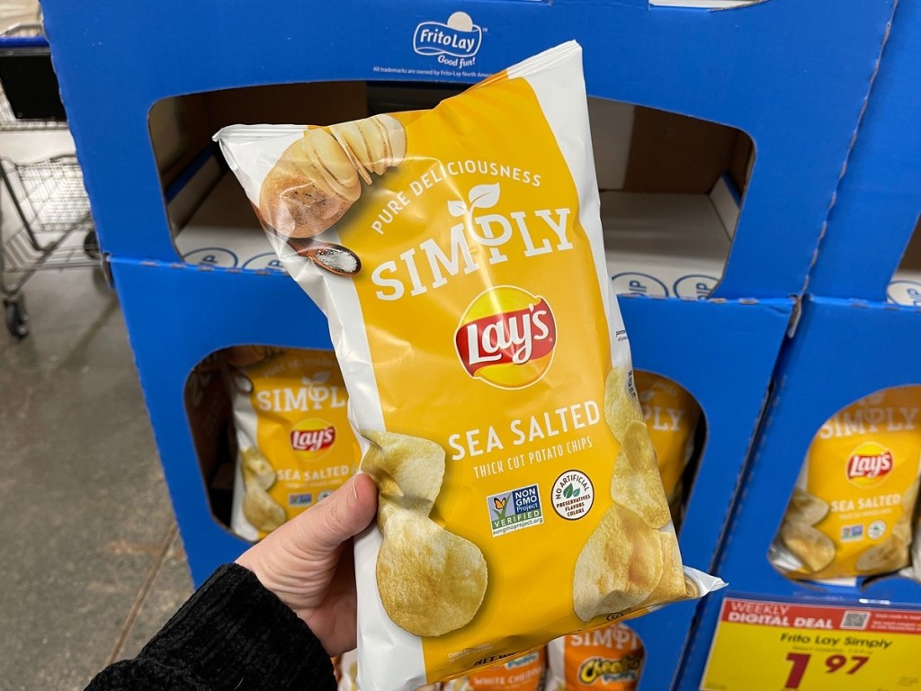 holding a bag of Simply Lay's potato chips