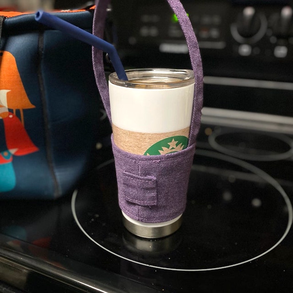 Starbucks tumbler drink in sling holder