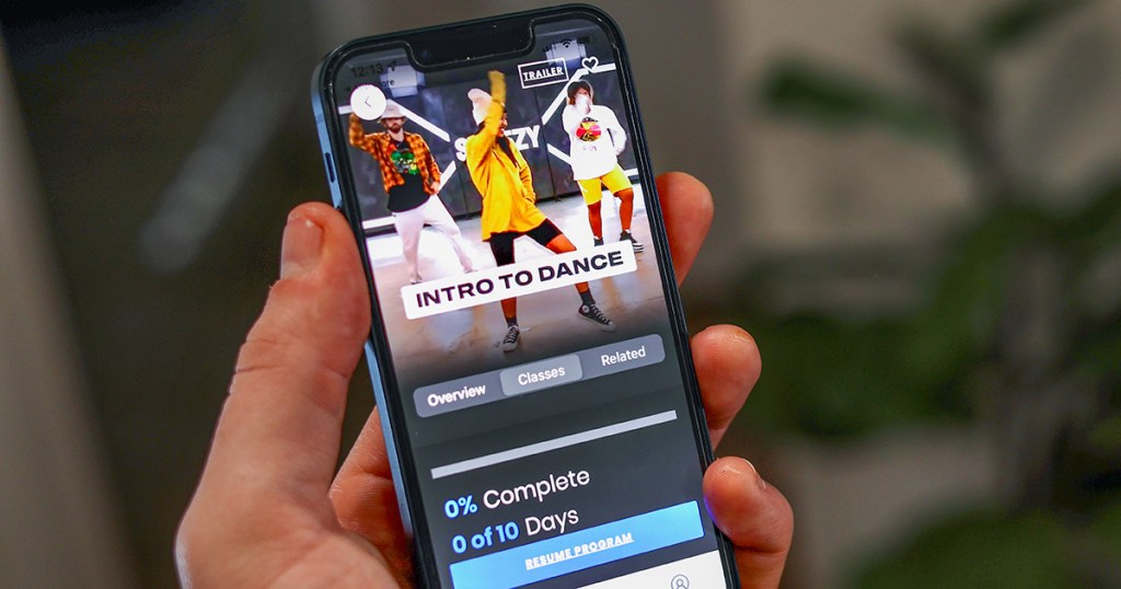 hand holding phone showing steezy dance studio app