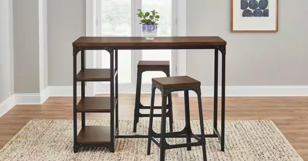 black and brown metal dining table and two stools