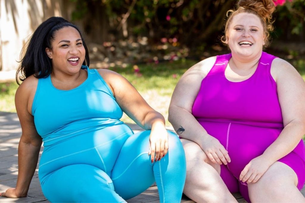 two women wearing plus size workout clothing