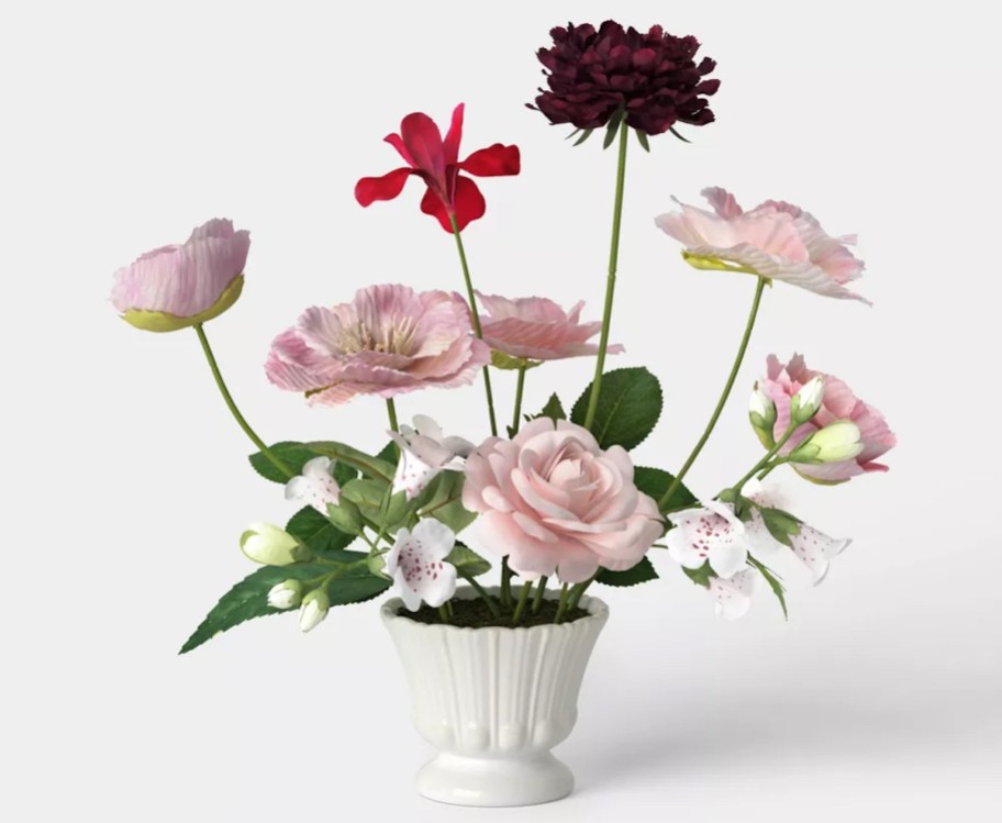 stock photo of flower arrangement in feminine white vase