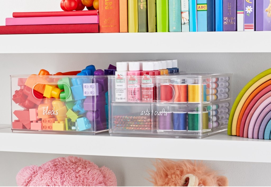 clear storage bins holding colorful arts and crafts supplies