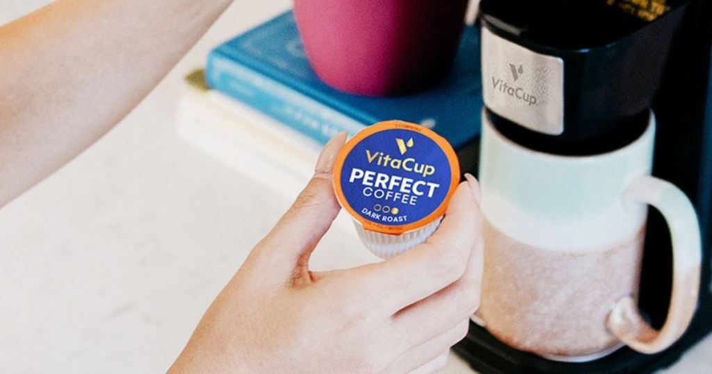 hand holding VitaCup Perfect Coffee pod