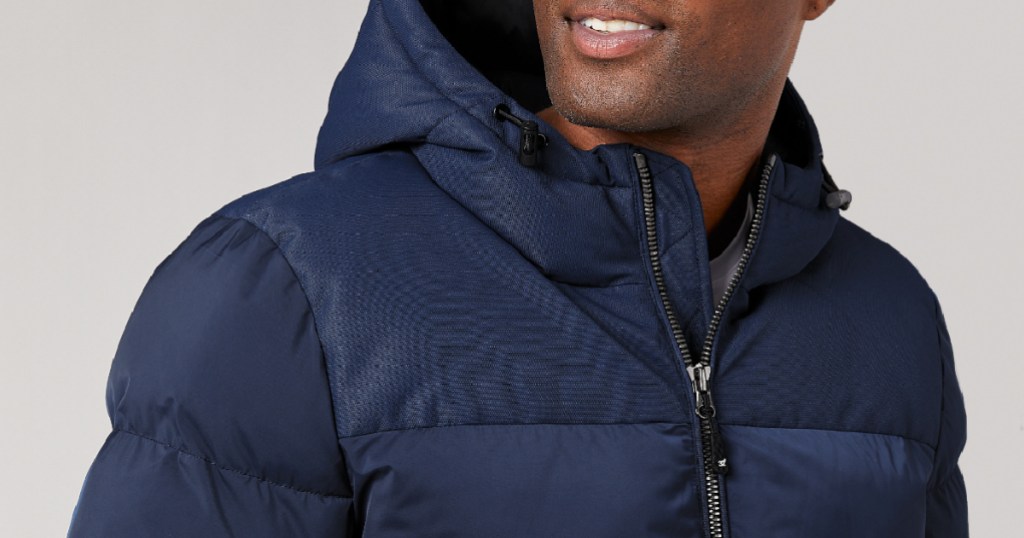 man wearing navy blue hooded puffer jacket