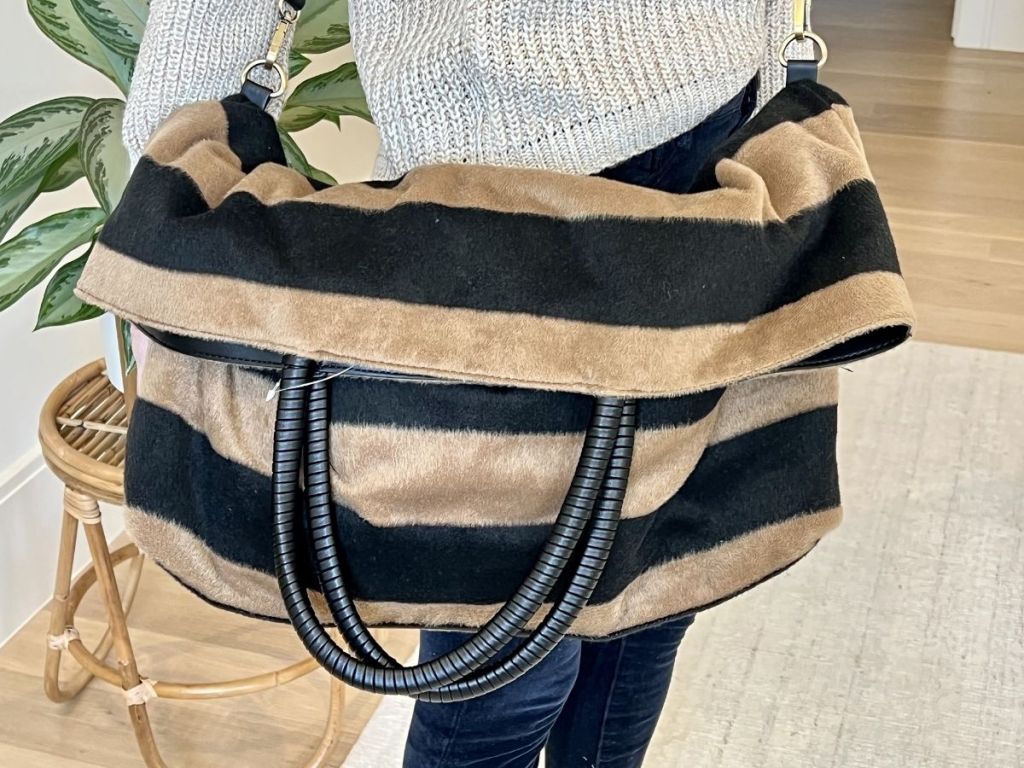 woman holding striped Fuzzy Anrthro bag