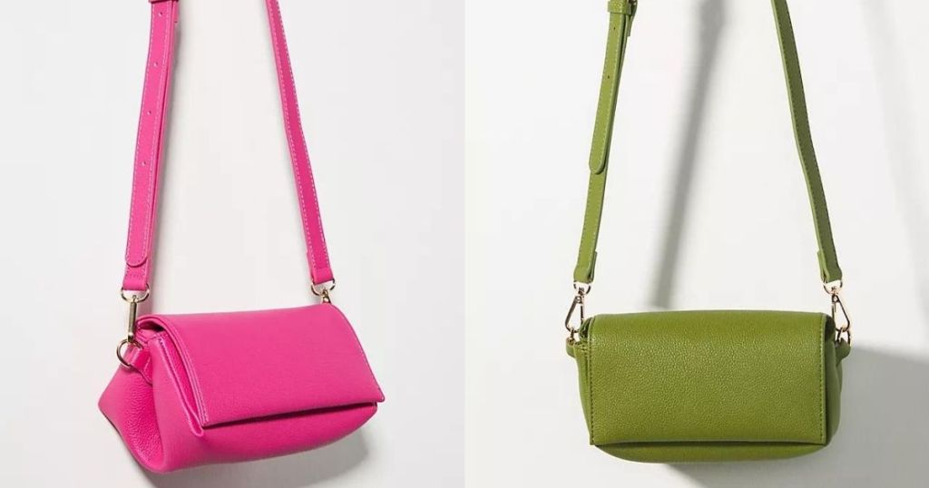 Anthro pink and Anthro geen bags hanging on hooks
