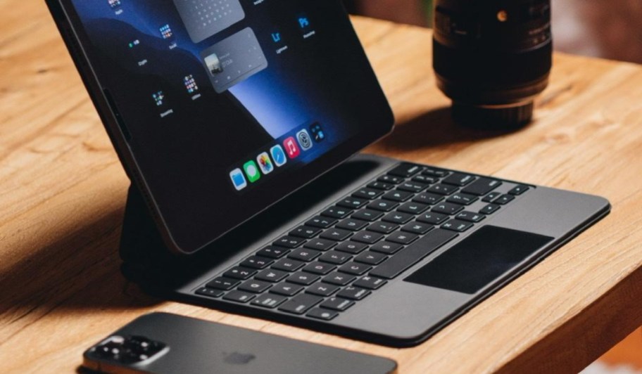 apple magic keyboard in black with ipad on table