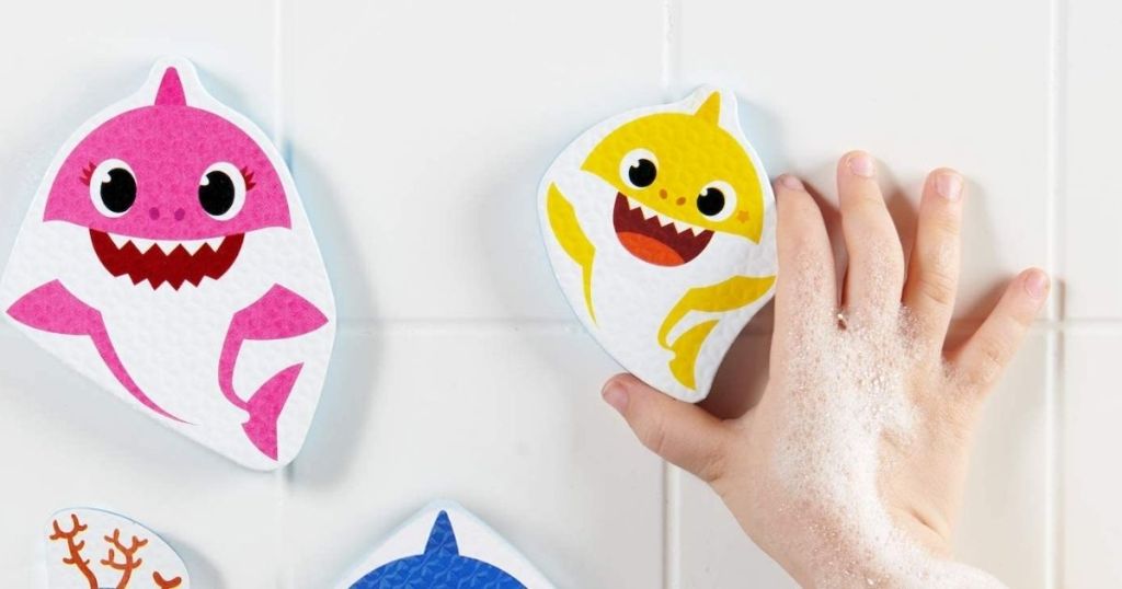 kid playing with Baby Shark Bath Stickers in a tub