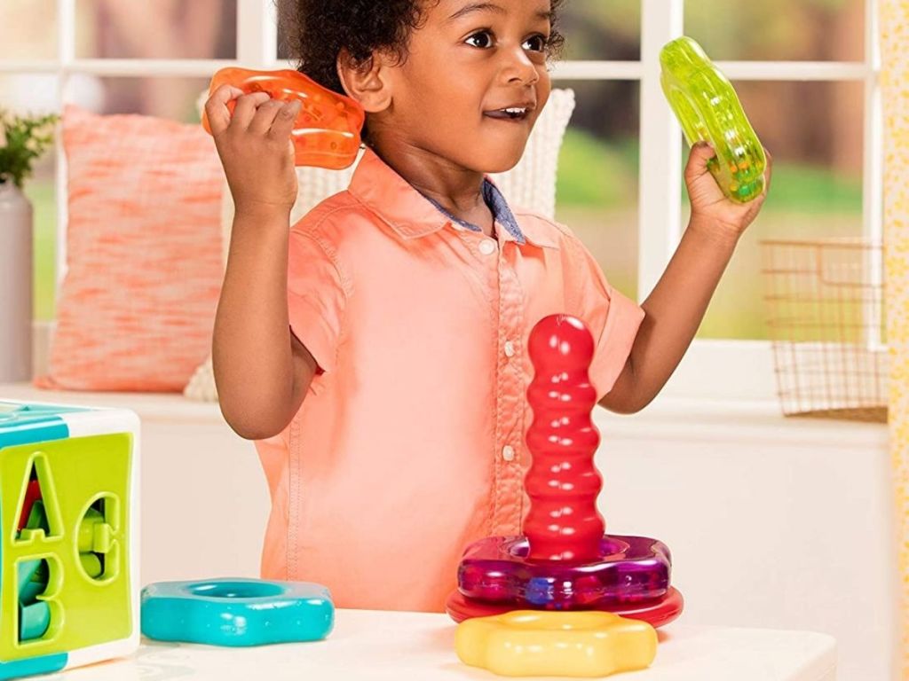 Little boy playing with Battat Shape Sorter Toy 