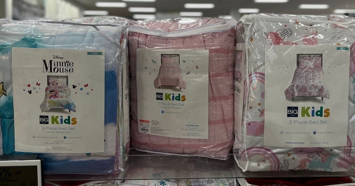 three packages of comforters in a store