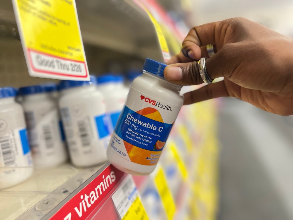 CVS Health Chewable C bottle being removed from store shelf