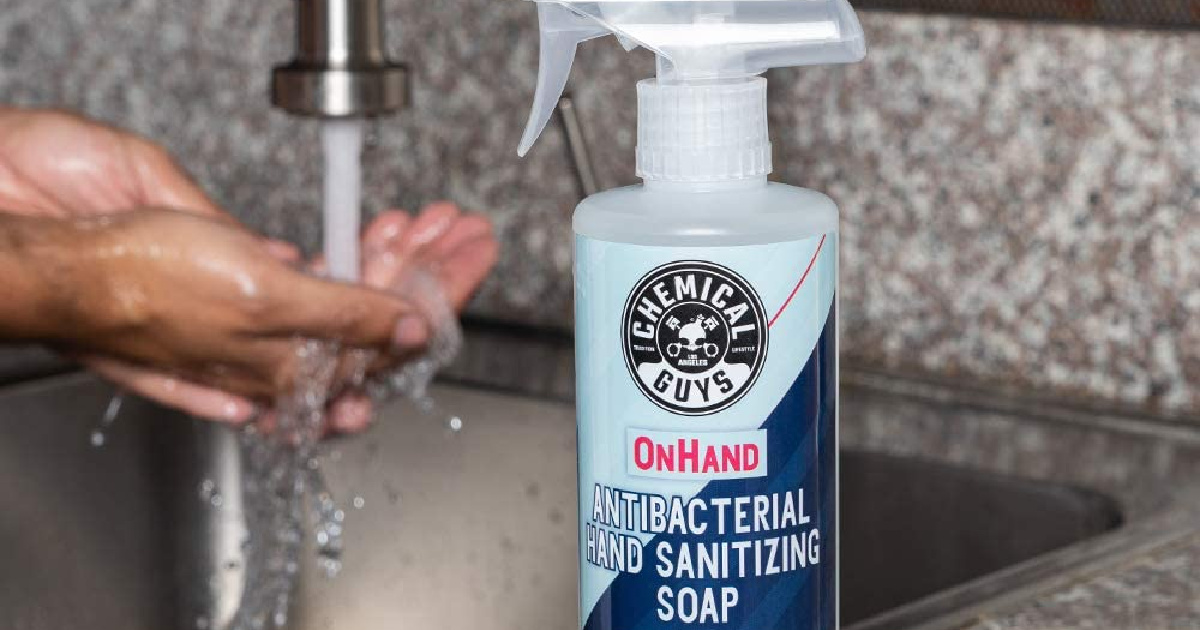 bottle of hand sanitizing soap and man washing hands